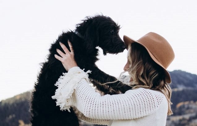 woman celebrates her puppy on national puppy day