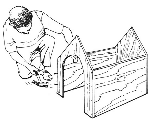 man assembles plywood pieces