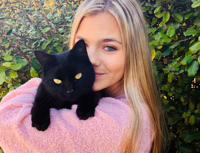 Cat mum celebrating International Cat Day