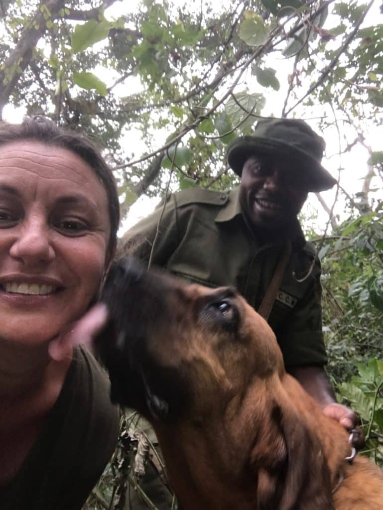 Maria Alojaman with a tracker and dog