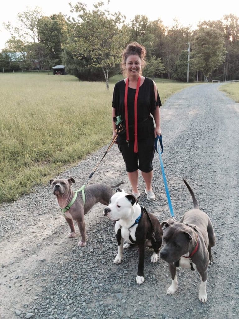 Maria Alojaman with dogs in training