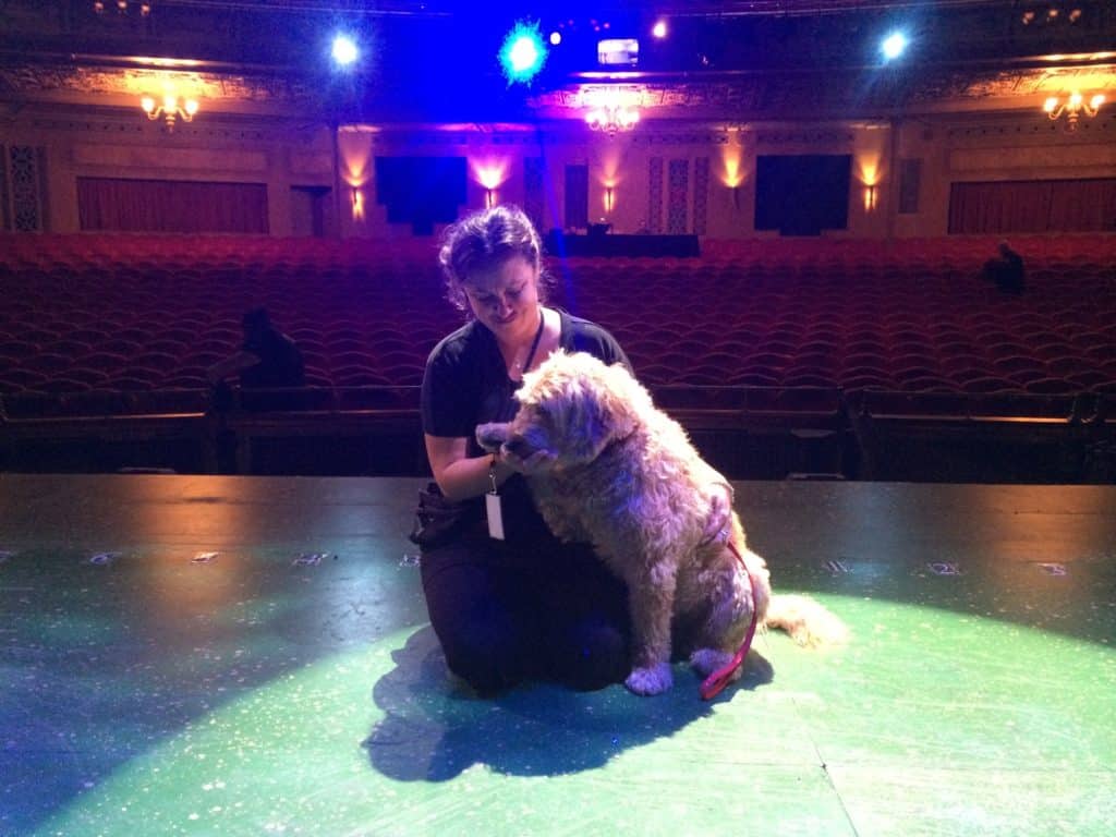 Maria Alojaman with a dog she is training 