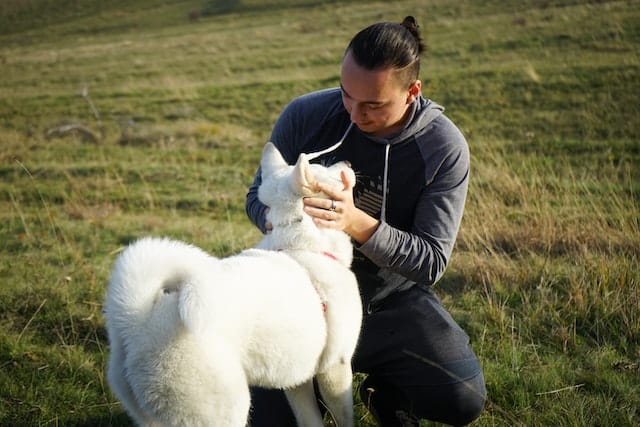 man takes his dog to a new park to celebrate Random Acts of Kindness Day