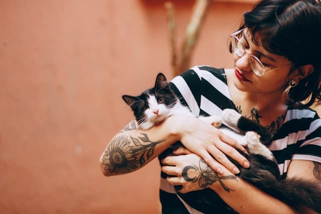 woman is crazy about her cat