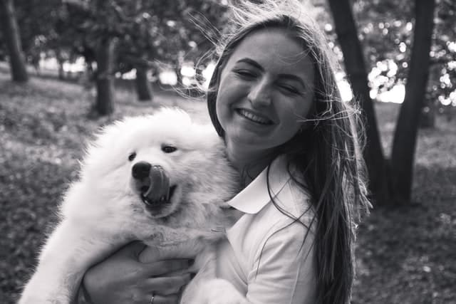 woman celebrates National Love Your Pet Day with her dog