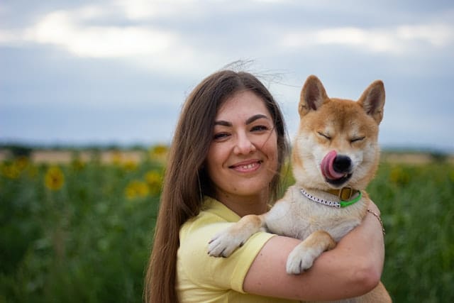 Registered NZ dog breeder hugs her dog