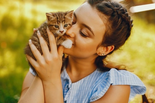 a girl with her kitten