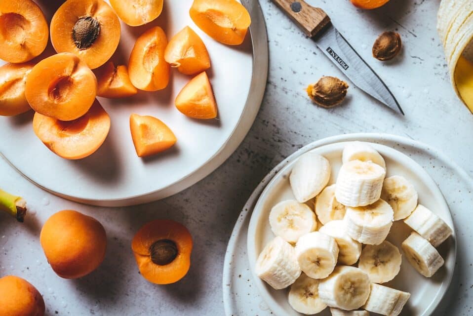Sliced apricots and bananas prepared for dog-friendly snacking