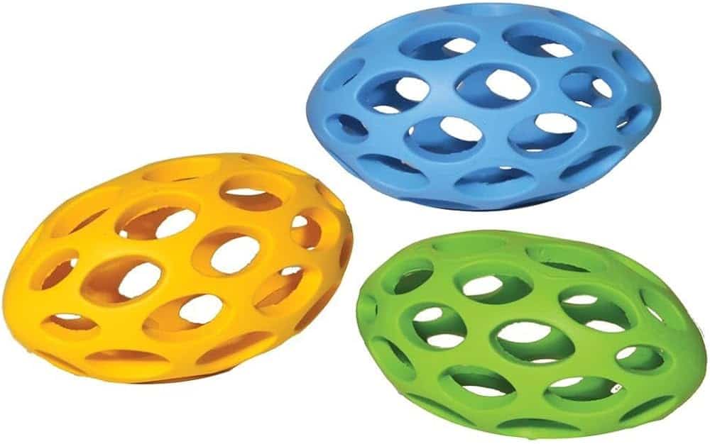 Three perforated dome-shaped toys in blue, yellow, and green are placed side by side. These make excellent Christmas presents for dogs, sure to delight your furry friend during the festive season. Perfect picks if you're searching for good Christmas gifts for dogs in NZ!