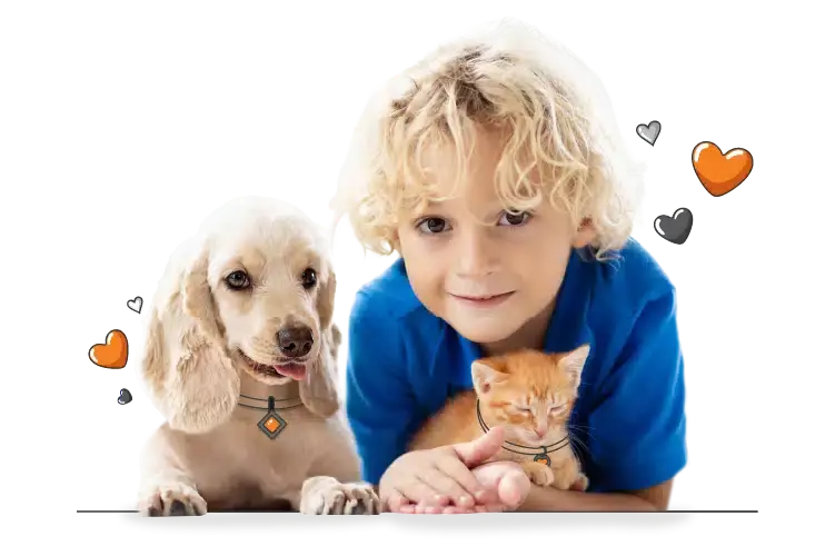 A young child in a blue shirt lies next to a light-colored dog and an orange kitten, all facing the camera with small heart icons around them—celebrating the world pet health month promise of care and companionship.